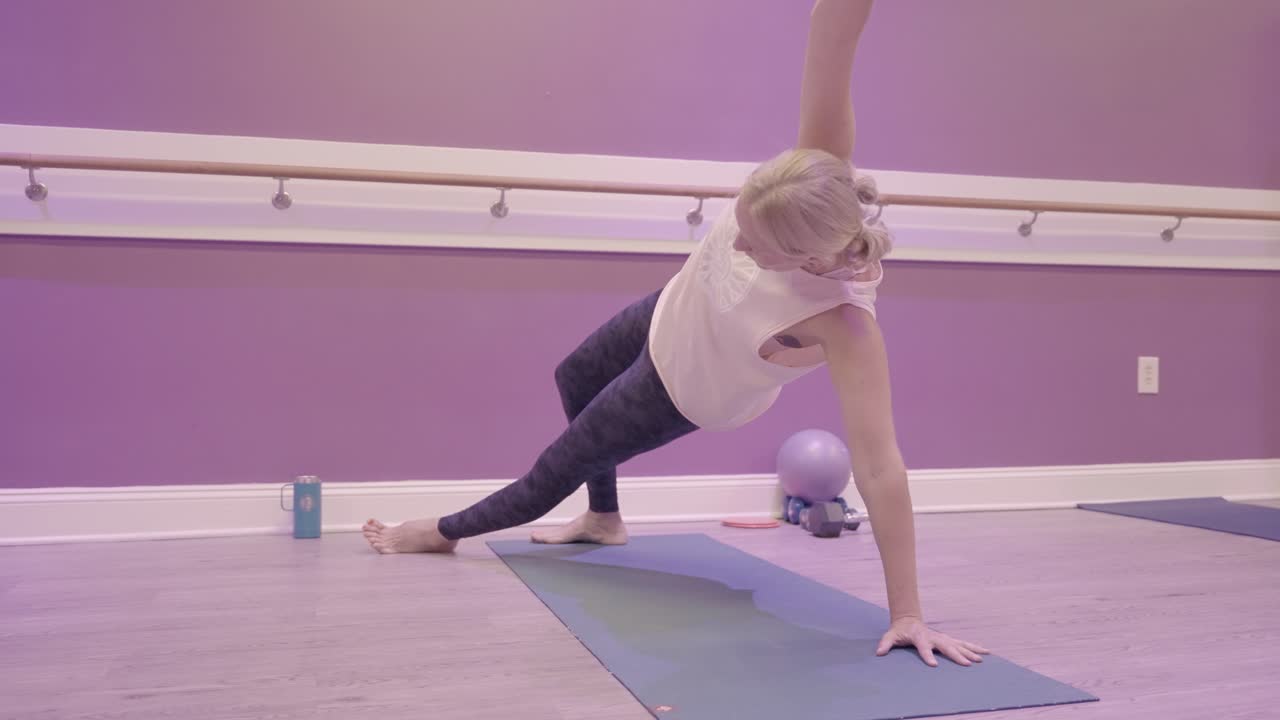 Woman doing yoga and pilates in a studio