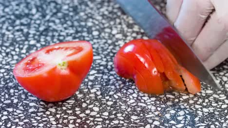 cut the tomato with a knife