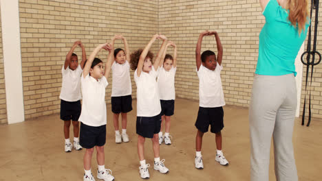 pupils and teacher during sports lesson