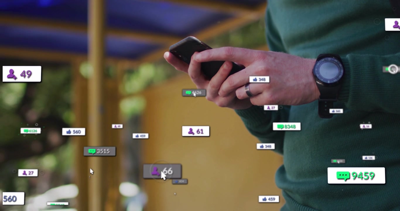 Man under roof tapping phone on ping, social media badges popping around phone, sorting messages