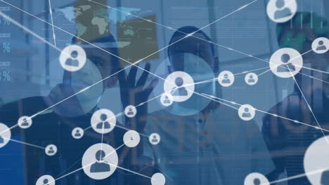 Animation-of-network-of-connections-with-icons-over-diverse-businesspeople-in-office