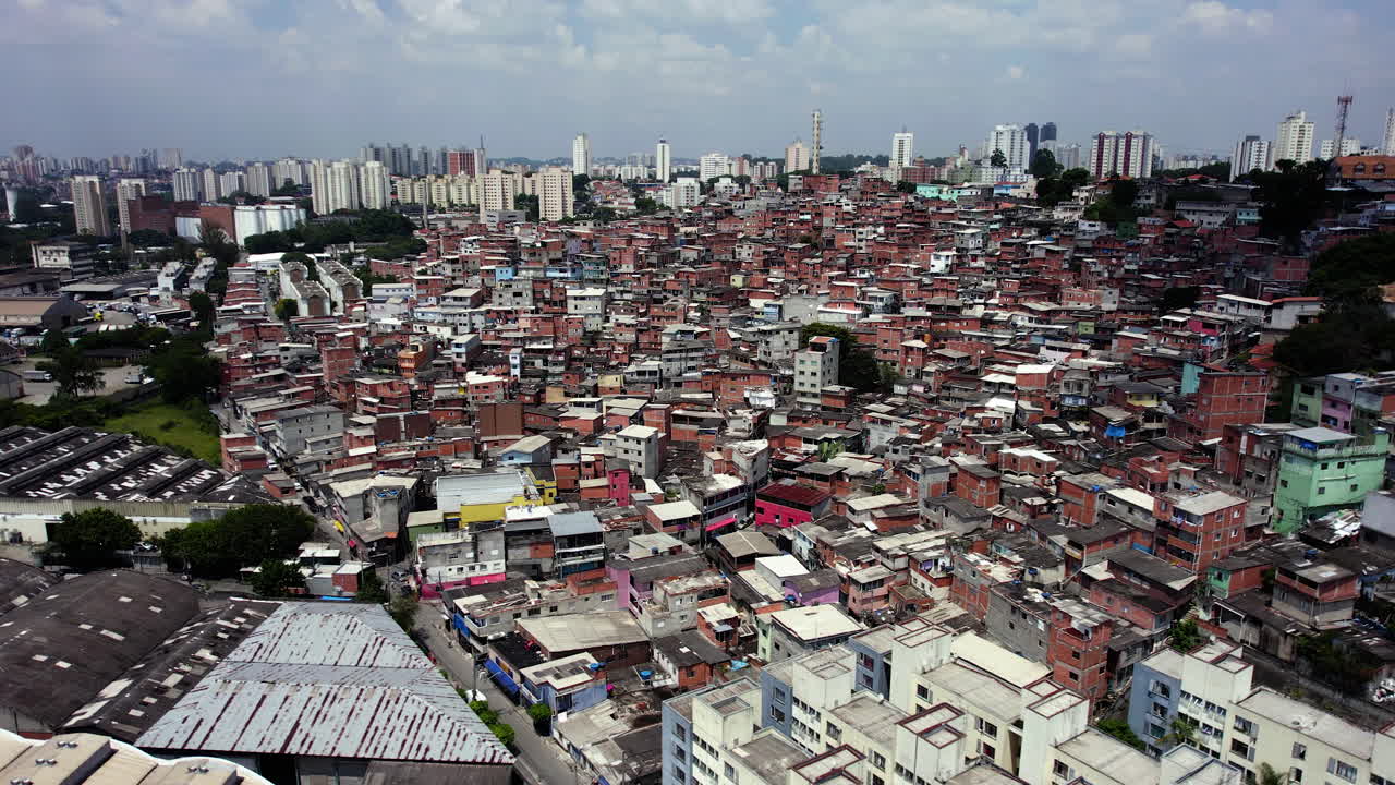 Large favela poor living in sunny Sao Paulo, South America - Static, drone shot