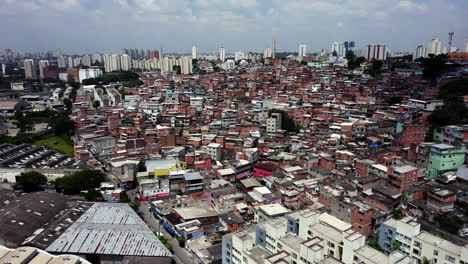 large favela poor living in sunny sao paulo, south america - static, drone shot