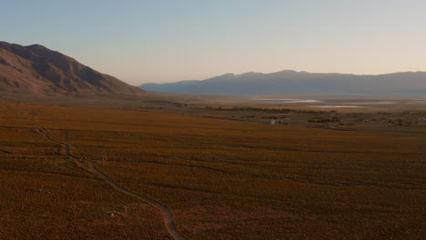 the sierra nevada during sunrise with in the background a hotel and rv campsite