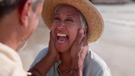 couple, beach and wink while laughing