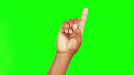 finger, point and green screen in closeup studio