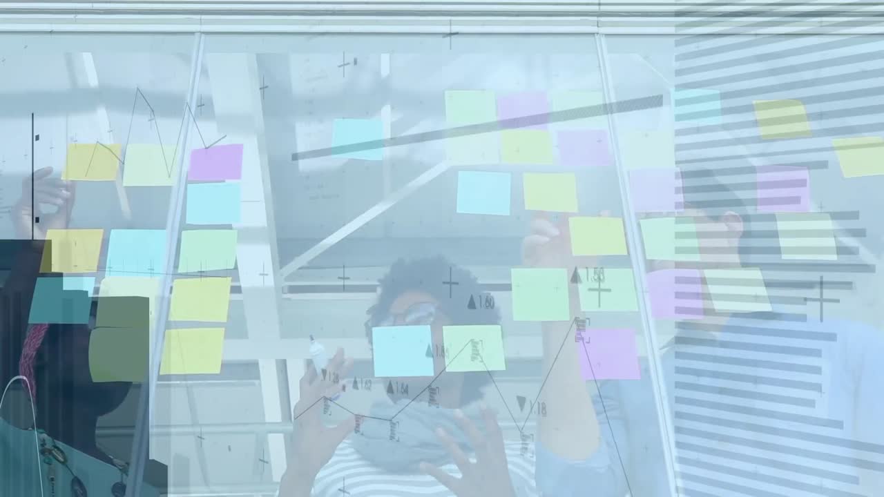 Animation of data processing over diverse group of business people taking notes on glass wall