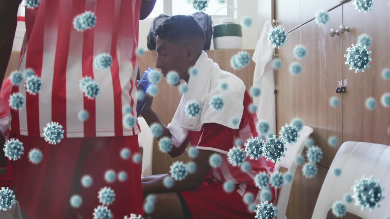 변기실에 있는 축구 선수들에 대한 코로나 19 세포의 애니메이션