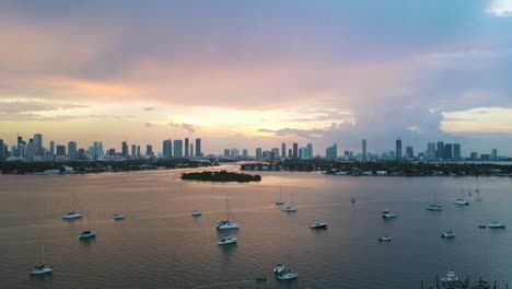 colorful sunset time lapse of boats in miami, florida ocean harbor