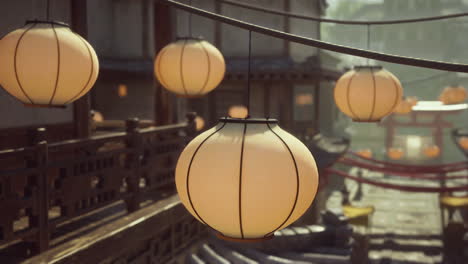 japanese style street with hanging lanterns at night