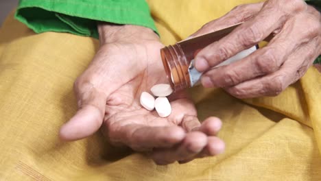 elderly woman taking medication