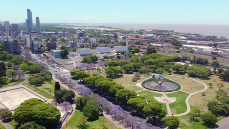 Aerial-view-establishing-the-wealthy-neighborhood-of-Recoleta-in-Buenos-Aires,-green-areas-for-strolling,-Floralis-Genérica-and-luxury-buildings