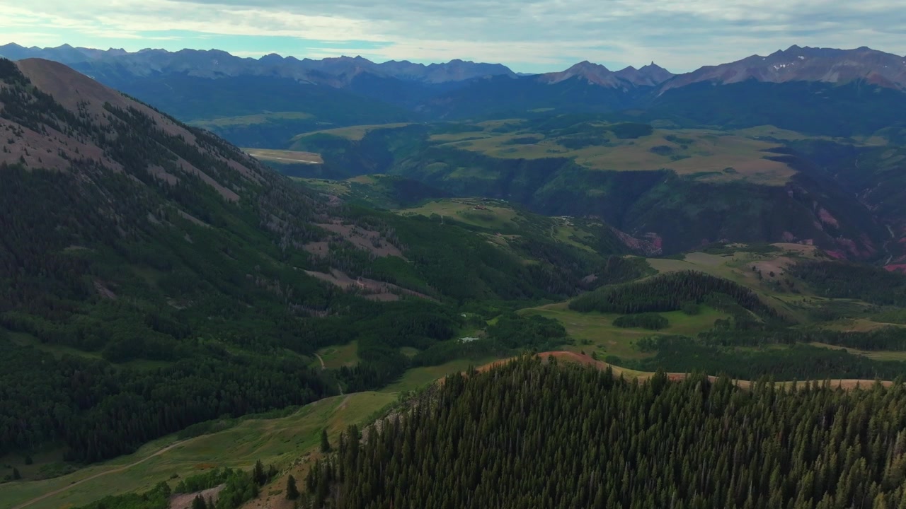 Aspen Trees Ridgway Telluride airport Box Canyon Colorado Summer Last Dollar Road aerial drone Mount Sneffels Wilderness ranchland San Juan Rocky Mountains Uncompahgre Forest forward pan up motion
