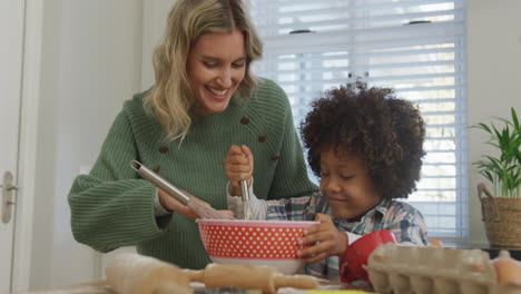 Video-of-biracial-son-and-caucasian-mother-cooking-together