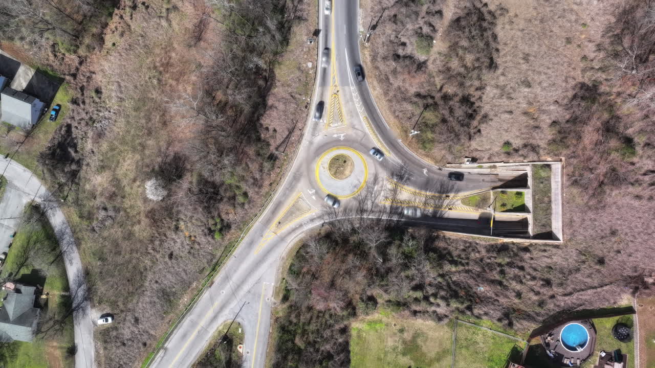 Top down aerial timelapse of cars moving through a roundabout in Chattanooga, TN.