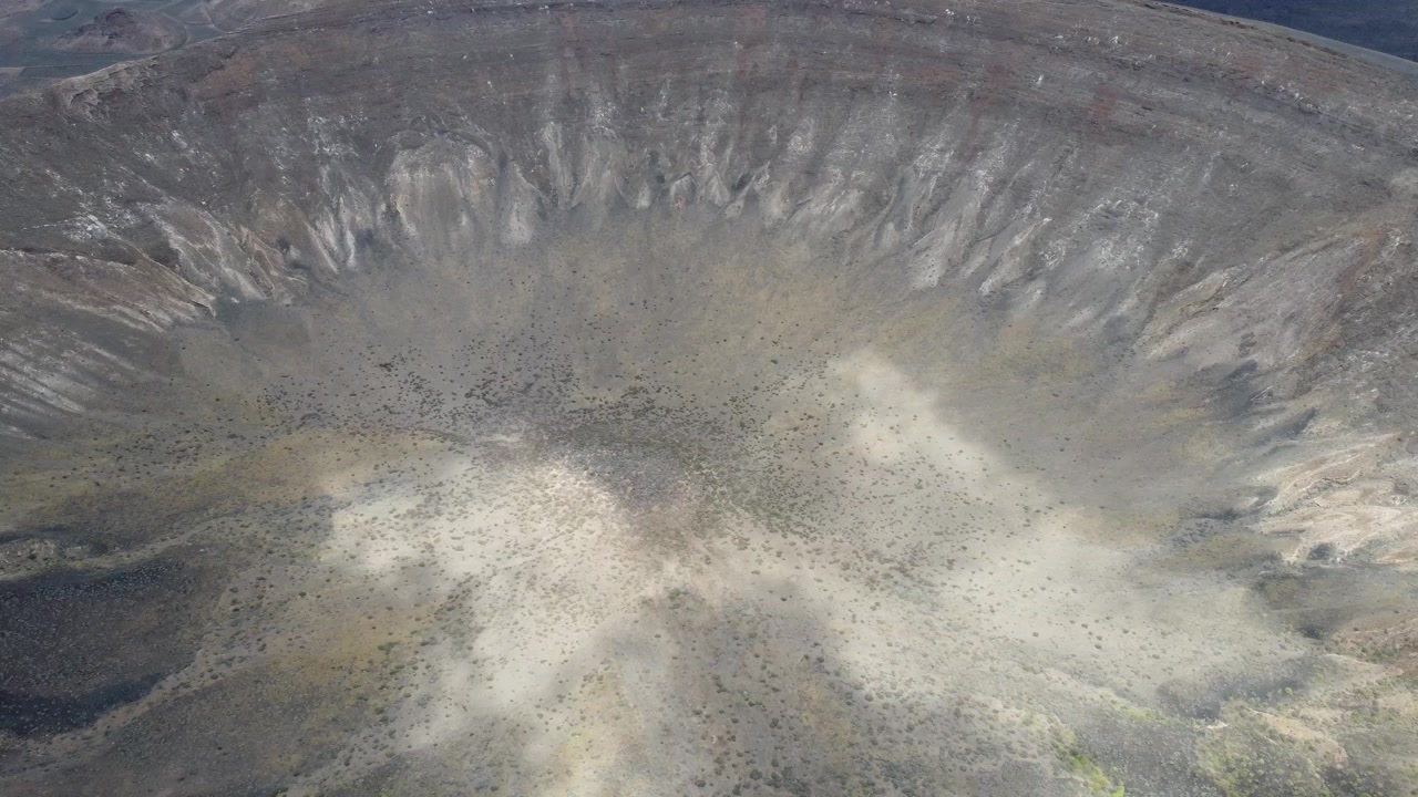 big volcano crater on the canary island of lanzarote, nice weather (by drone)