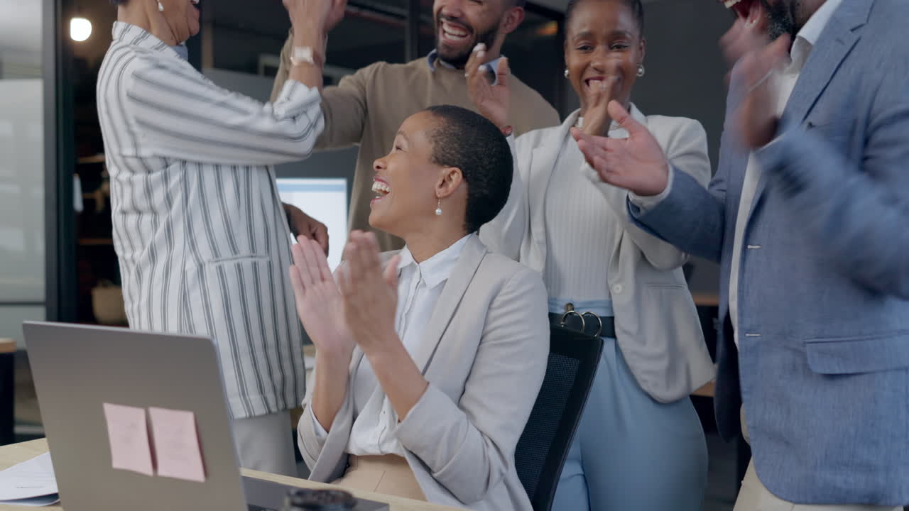Clapping, laptop and business people high five