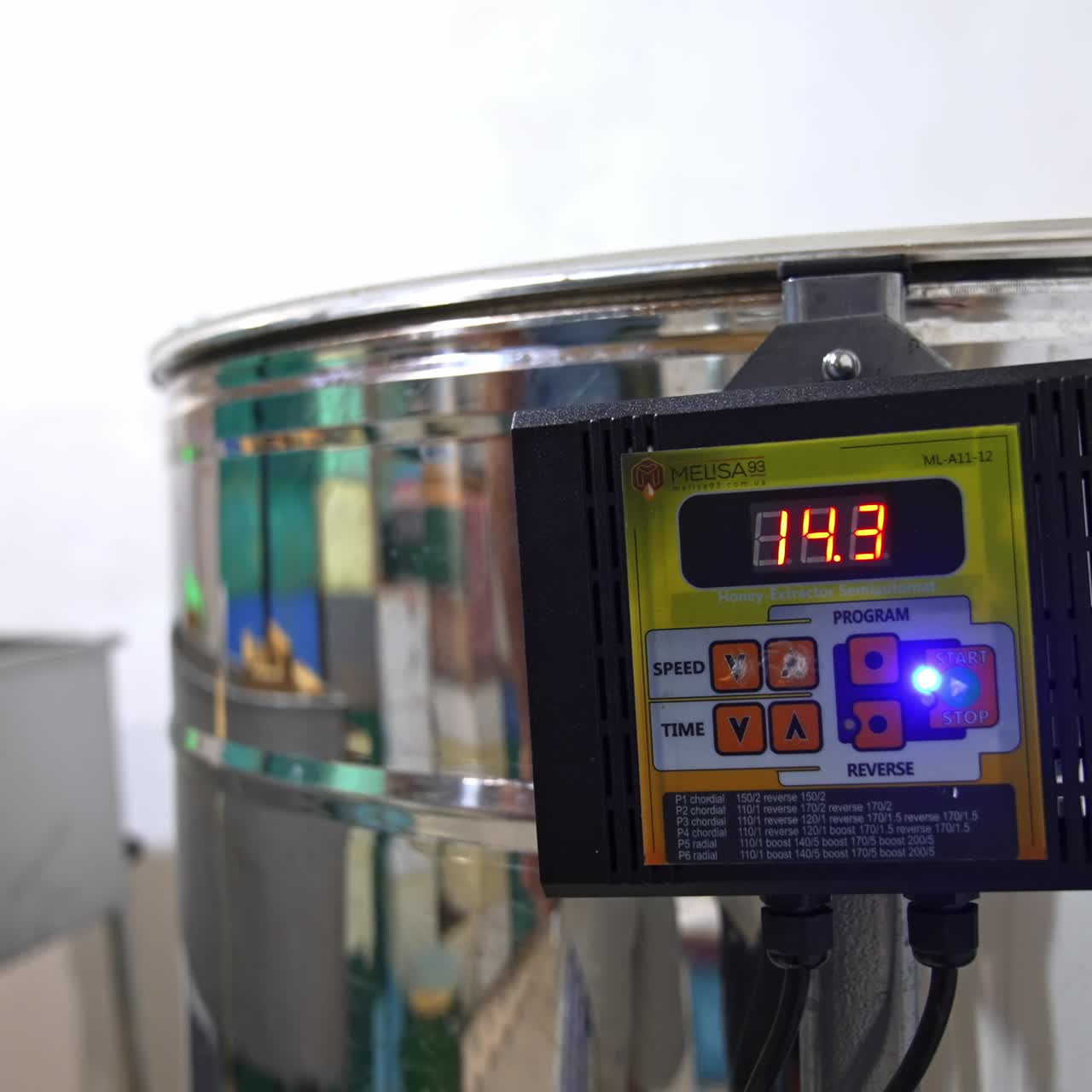 Male hand switching on the button on the centrifuge apparatus. Man presses one more button to increase the speed of work of equipment. Close up