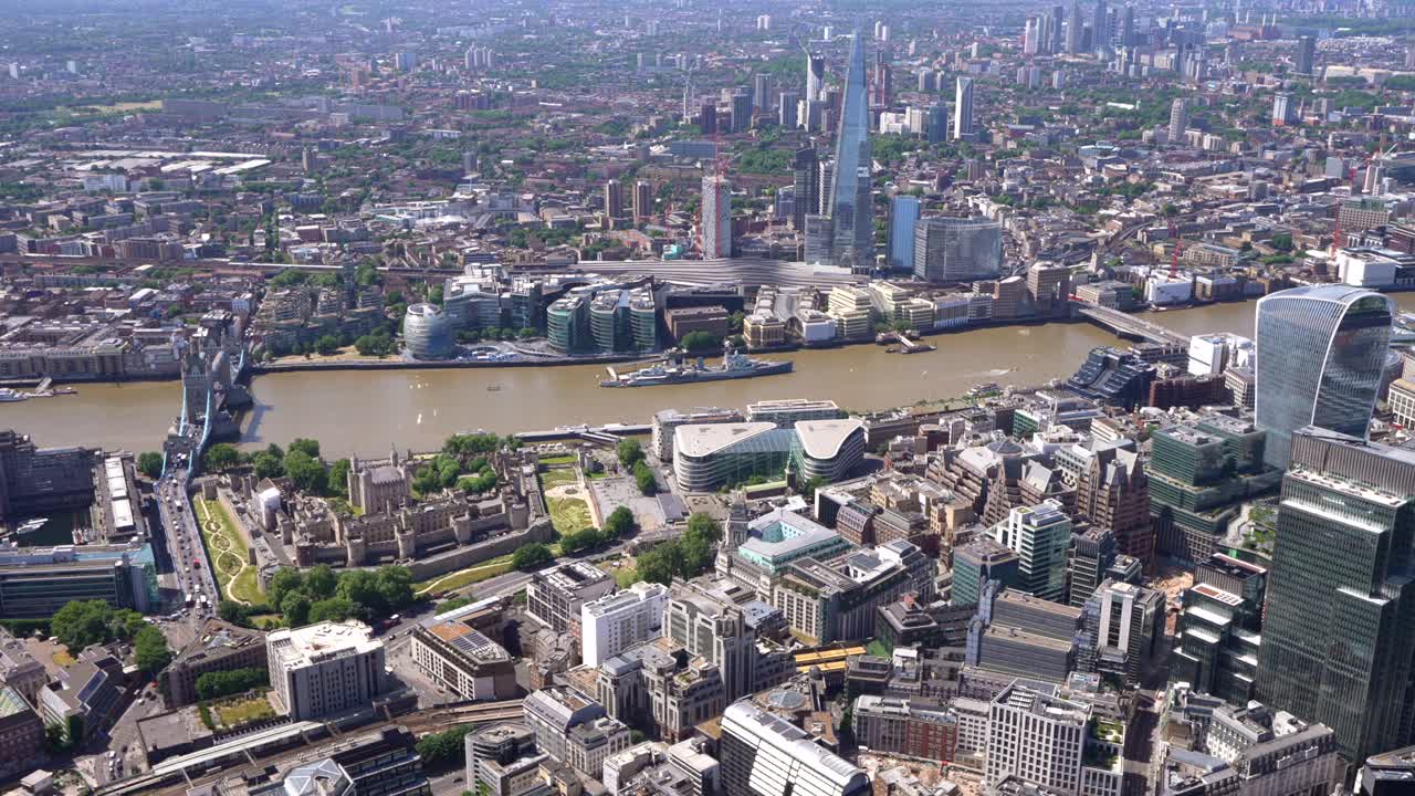 Aerial views of Tower Bridge, the Tower of London, River Thames, the Shard and Fenchuch Street Station. London UK.