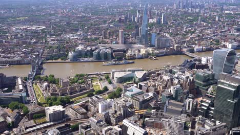 aerial views of tower bridge, the tower of london, river thames, the shard and fenchuch street station. london uk.