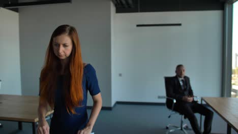 lady employee in blue formal dress leaving the office after being fired, employment and crisis concept