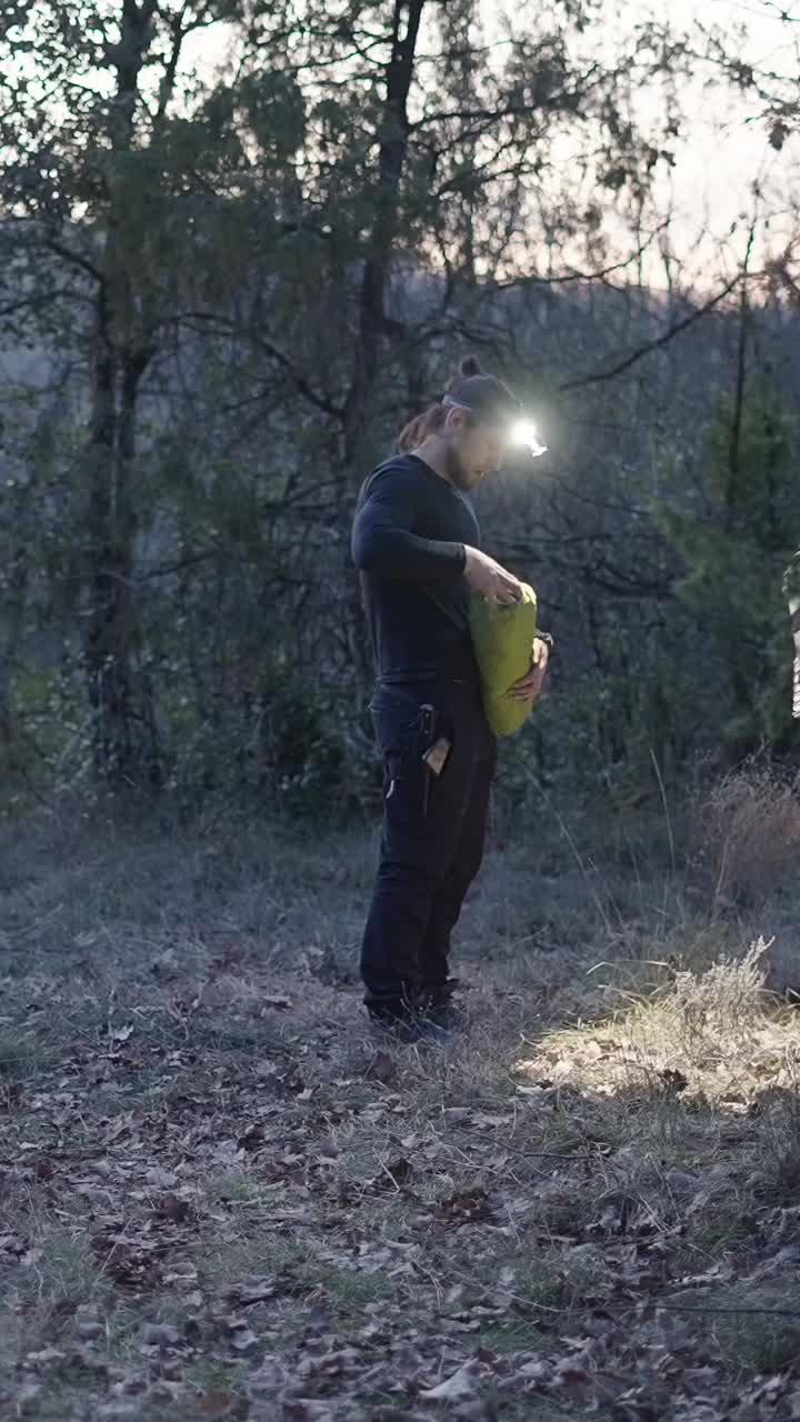 Man with headlamp outdoors at night