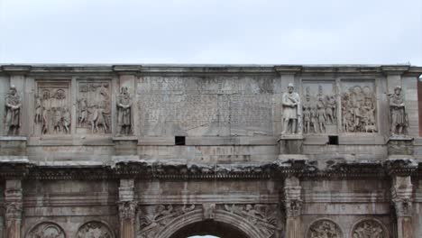 view of the upper part of the arch of constantine, rome, italy