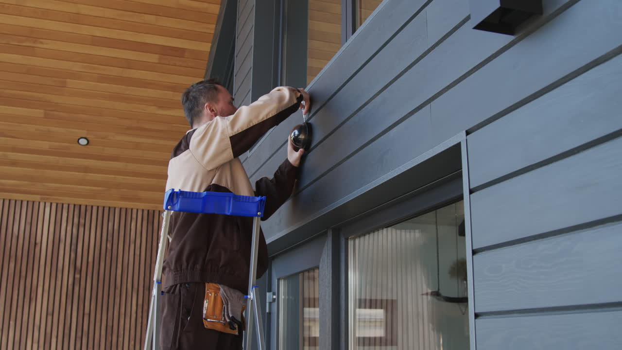 Contractor Installing Home Security Camera