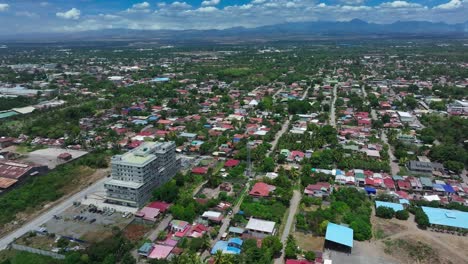 general santos cityscape with how income housing area during sunny day