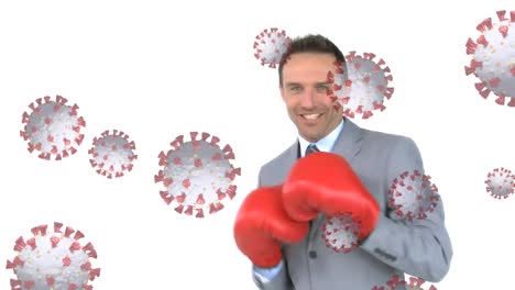 Animation-of-virus-cells-floating-over-caucasian-man-in-suit-boxing