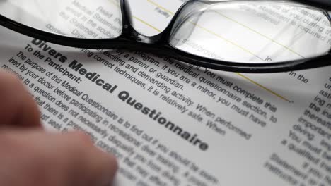 finger tapping on medical questionnaire form