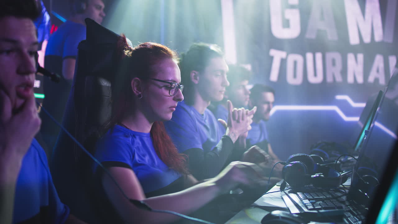 nervous Female Gamer Preparing for Match with Team Anxious Esportsman Gamer Woman Exhaling and Communicating with Teammates while Preparing for Professional Esports Tournament