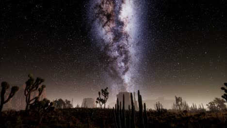 hiperlapso en el parque nacional del valle de la muerte desierto iluminado por la luna bajo las estrellas de la galaxia