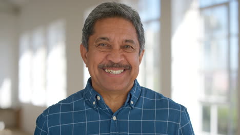 Face-of-a-happy-retired-man-inside-a-bright-room