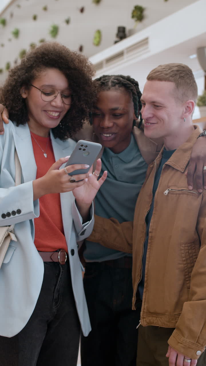 Friends Looking at a Phone Together