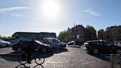 vehicles and cyclist navigating roundabout