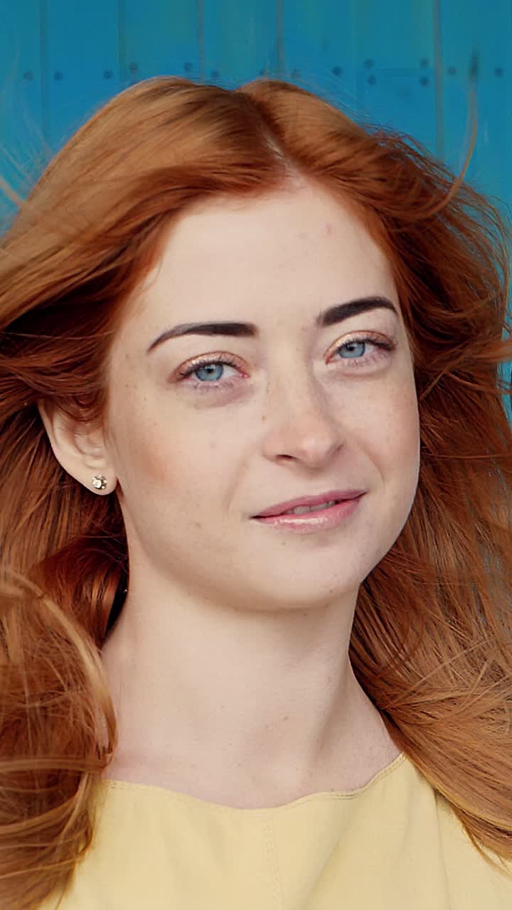 Portrait of a woman with red hair and a yellow dress