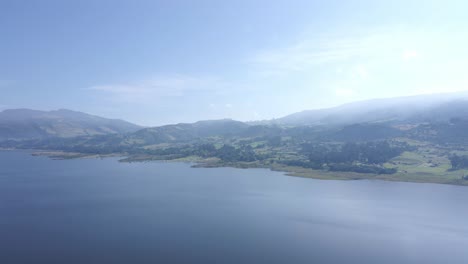 drone lake with mountains, sunrise, blue water, green mountains, cundinamarca, colombia, tomine, guatavita