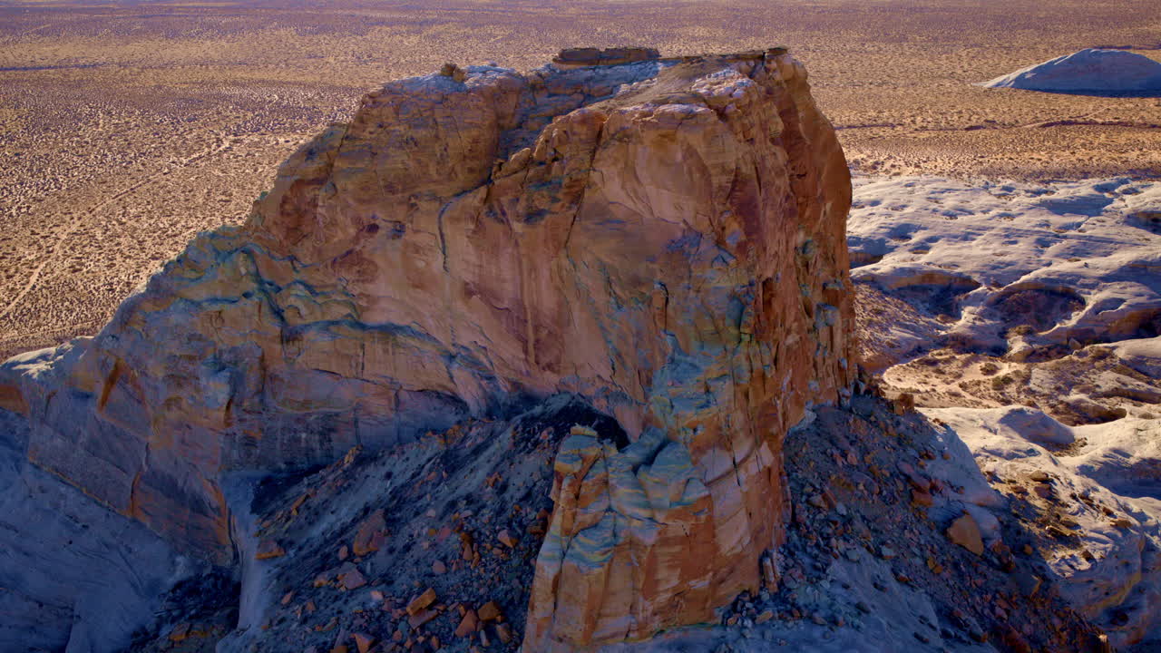The aerial camera showcases the spectacular erosion-carved formations of Glen Canyon, framed by the waters of Lake Powell.