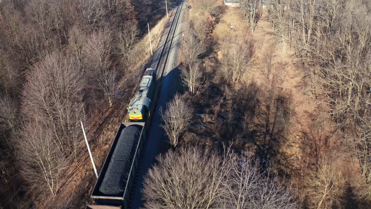 Aerial view of the forest in winter. Aerial view of a road in the middle of the forest