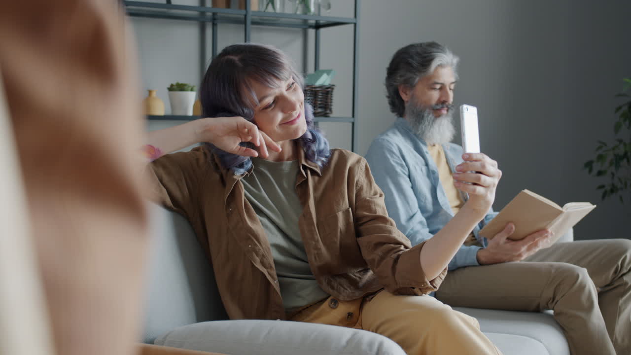 Couple taking a selfie on a sofa