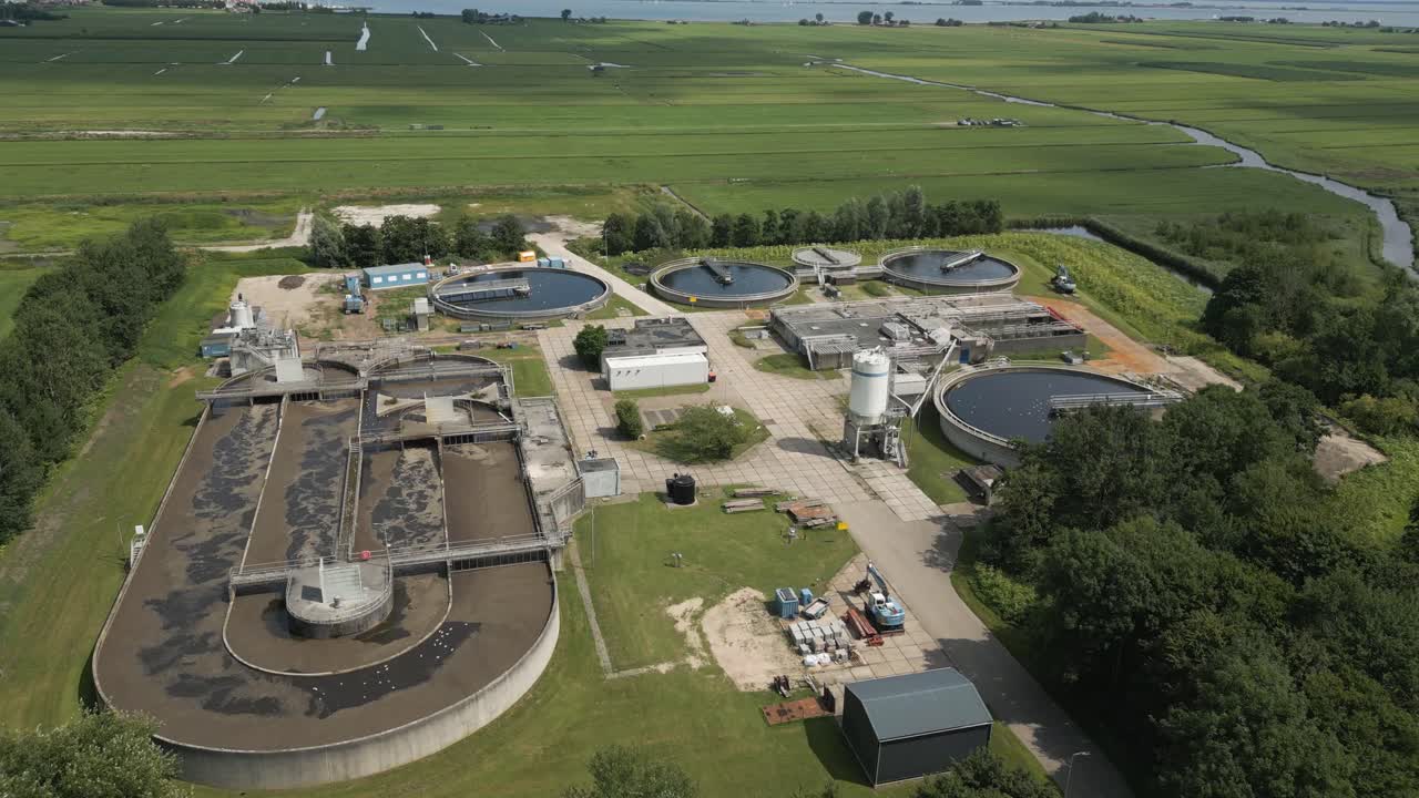 Drone view of a wastewater treatment plant in the Netherlands, located near Volendam. This facility is essential for clean water management and environmental protection in the region