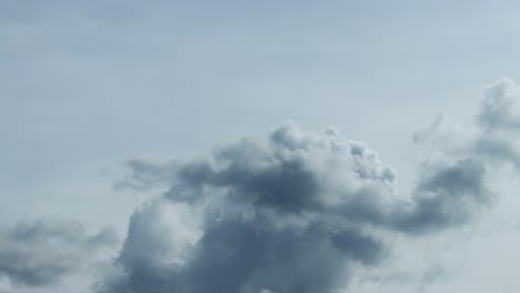 puffy cumulus clouds swirl at sunset . time lapse, relaxation dramatic beauty of weather atmosphere relaxation background rolling cumulus clouds