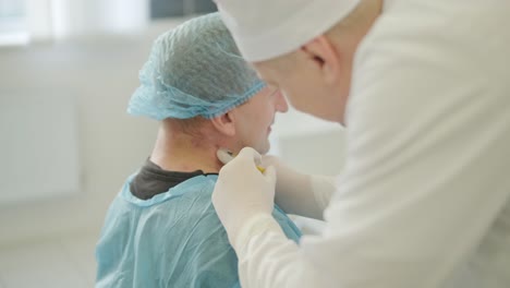 a doctor administering botulinum injections to a patient as a treatment for bruxism and spasticity. the clinical setting emphasizes professionalism and medical expertise