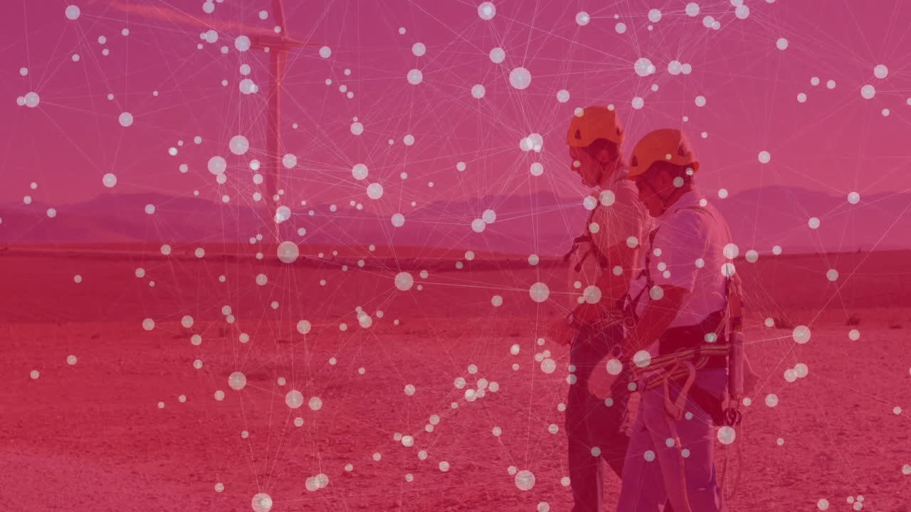 two men walking across desert technology site, inspecting wind turbine with animated data overlays
