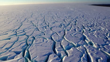 aerial view of a vast, cracked ice field