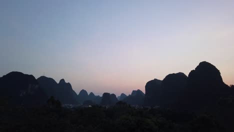 beautiful impressive karst mountain landscape in yangshuo at dusk, guangxi province, china
