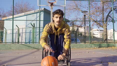 handicapped basketball player in a wheelchair dribbling like a professional.