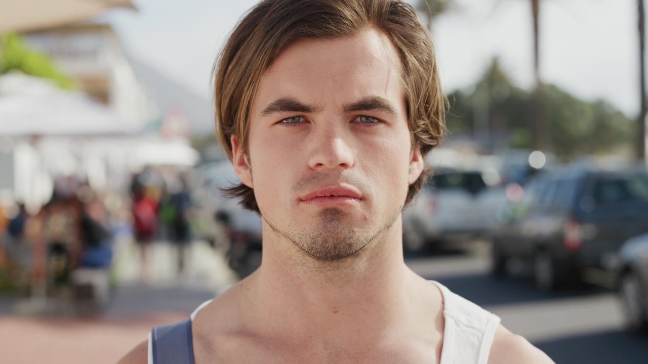 Portrait of a Young Man Standing Outdoors