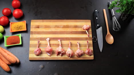 fresh raw chicken wings on a chopping board preparing for delicious food recipe